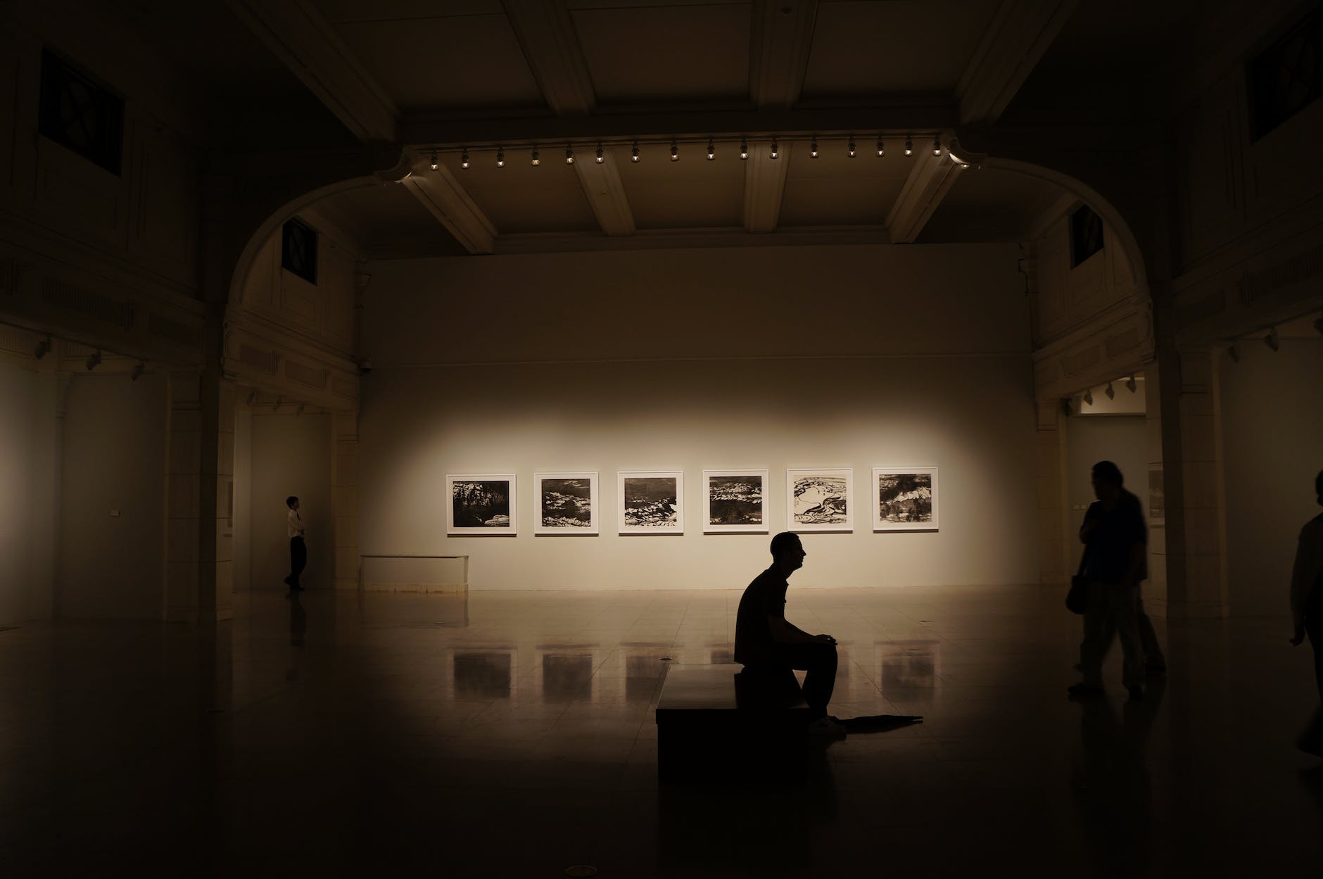 silhouette of person sitting on bench